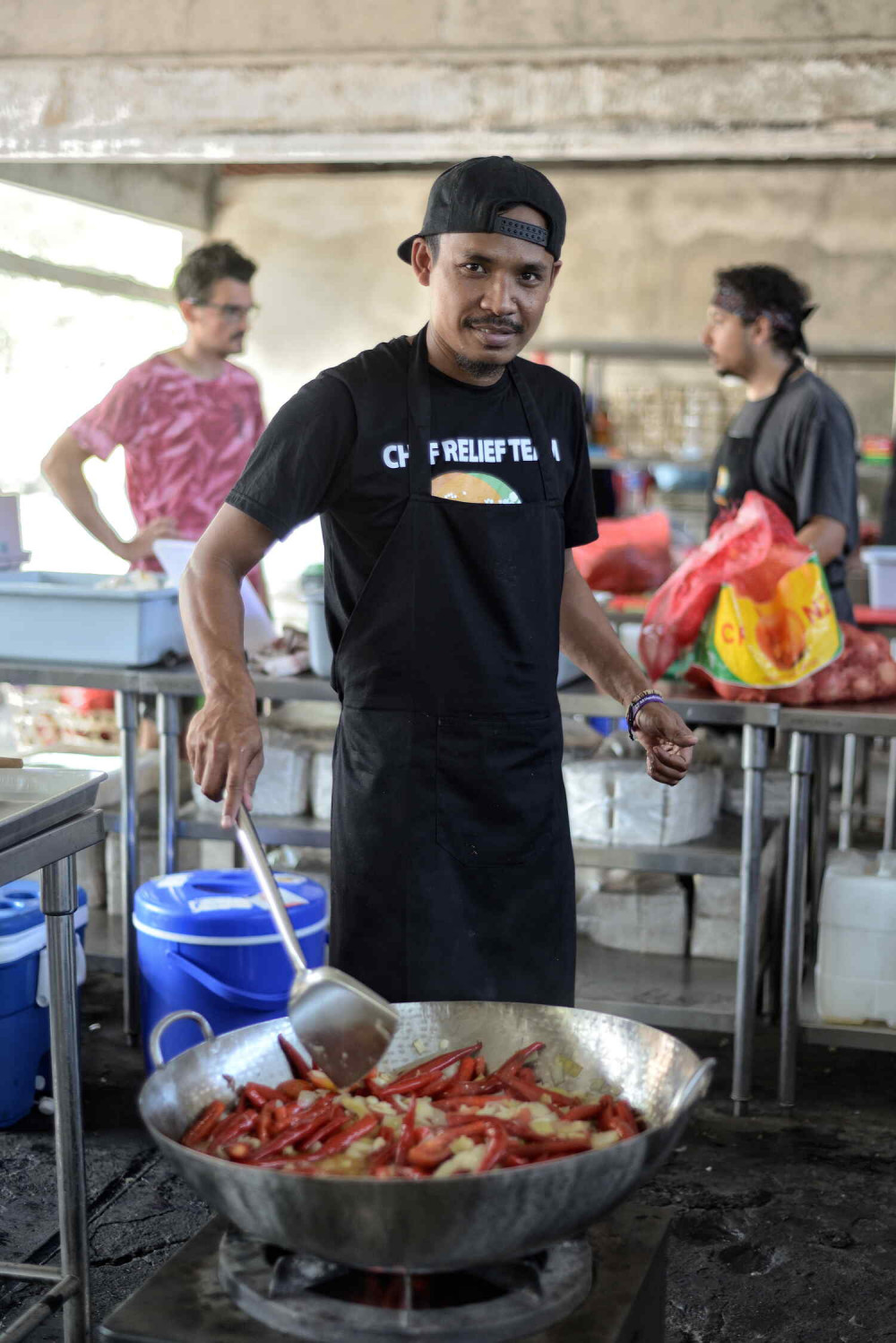 local chef from World Central Kitchen cooking food for the victims after earthquake hit northern lombok