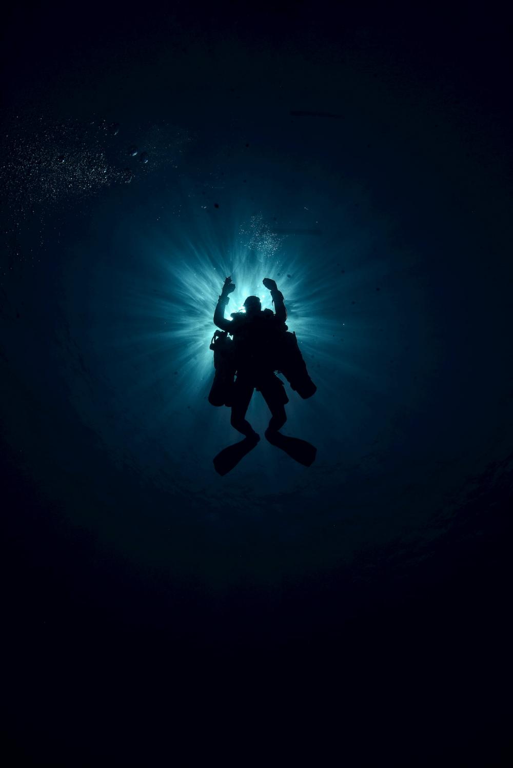 Picture of Technical Diver against sun light from underwater